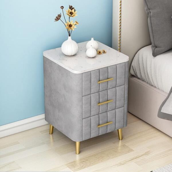 Macduibh Upholstered 3 Drawer Bedside - A Crown Furniture